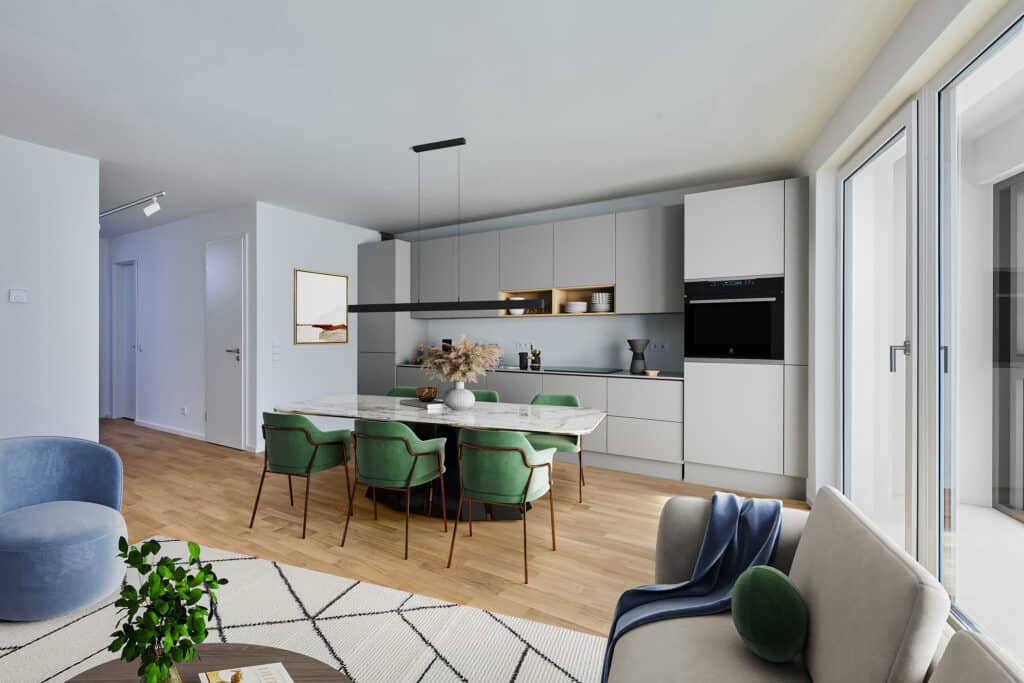 Offene Designküche mit großem Marmortisch, eleganten grünen Essstühlen und modernen Einbaugeräten.