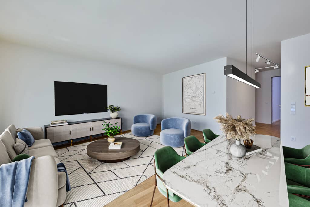 Gemütliches Wohnzimmer mit großem Sofa, blauem Sessel-Set, modernem TV-Bereich und angrenzendem Essplatz im offenen Wohnkonzept.